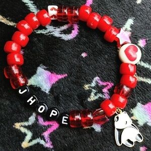 Handmade BTS J-Hope kandi bracelet with panda charm